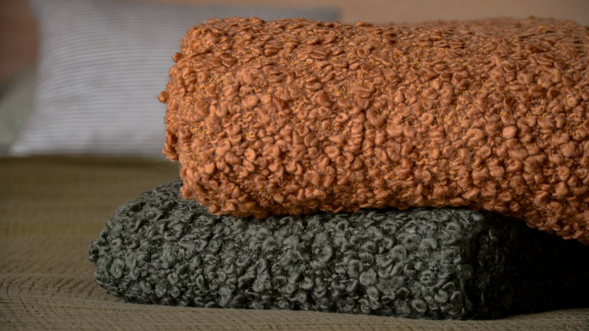 chunky knit throws in forest and cinnamon