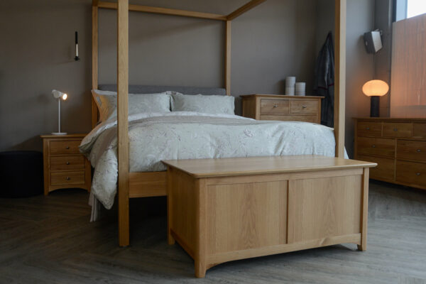 Oak Highland 4 poster bed shown with classic oak storage furniture