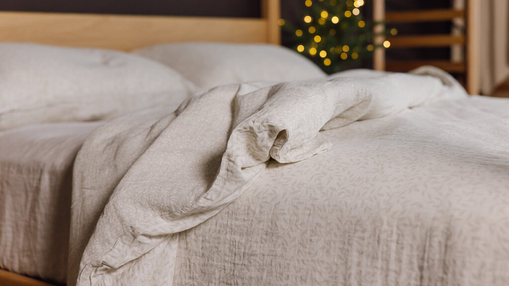 Ecru muslin bedding with mini leaf print.