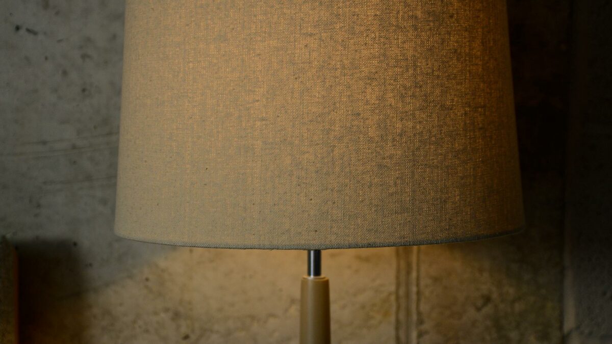 a close up view of our painted wooden lamp base with linen colour shade