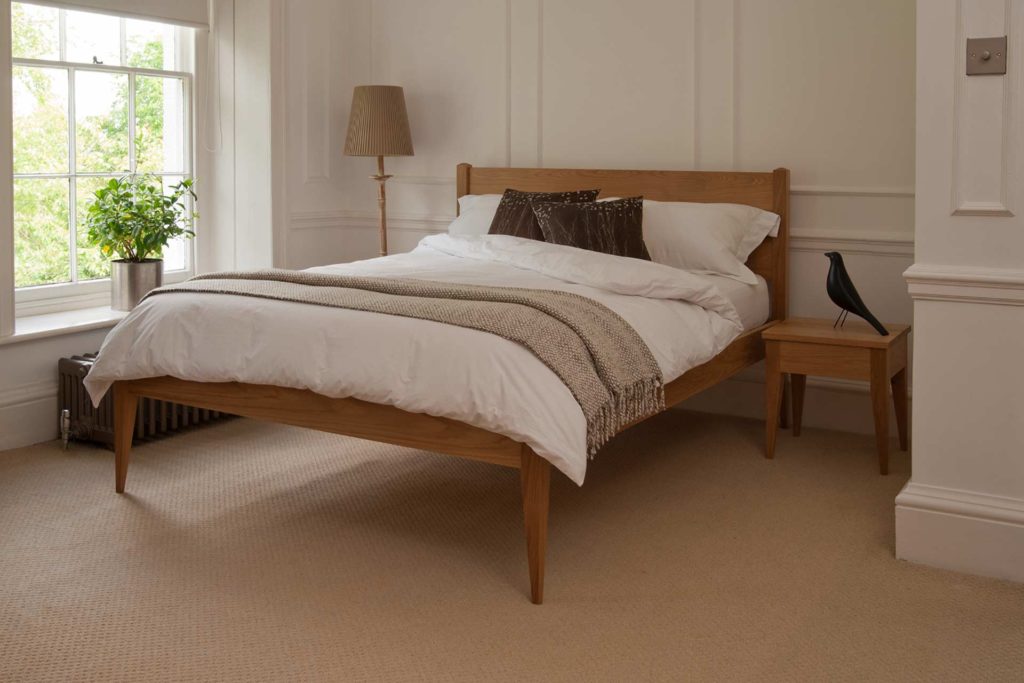 A Classic taller wooden Bed, The Cochin is available to order in a choice of timbers and bed sizes