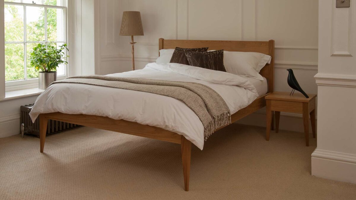 A Classic taller wooden Bed, The Cochin is available to order in a choice of timbers and bed sizes