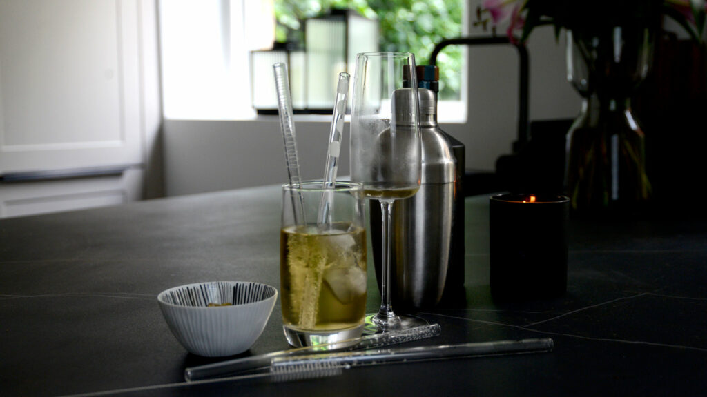 patterned glass drinking straws shown in use