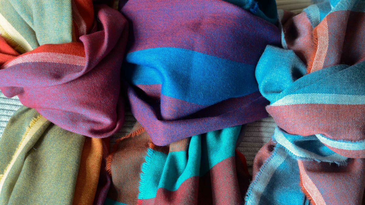 vibrant lightweight woven merino wool scarves in a choice of colour ranges