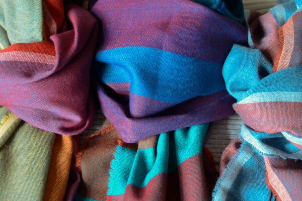 vibrant lightweight woven merino wool scarves in a choice of colour ranges