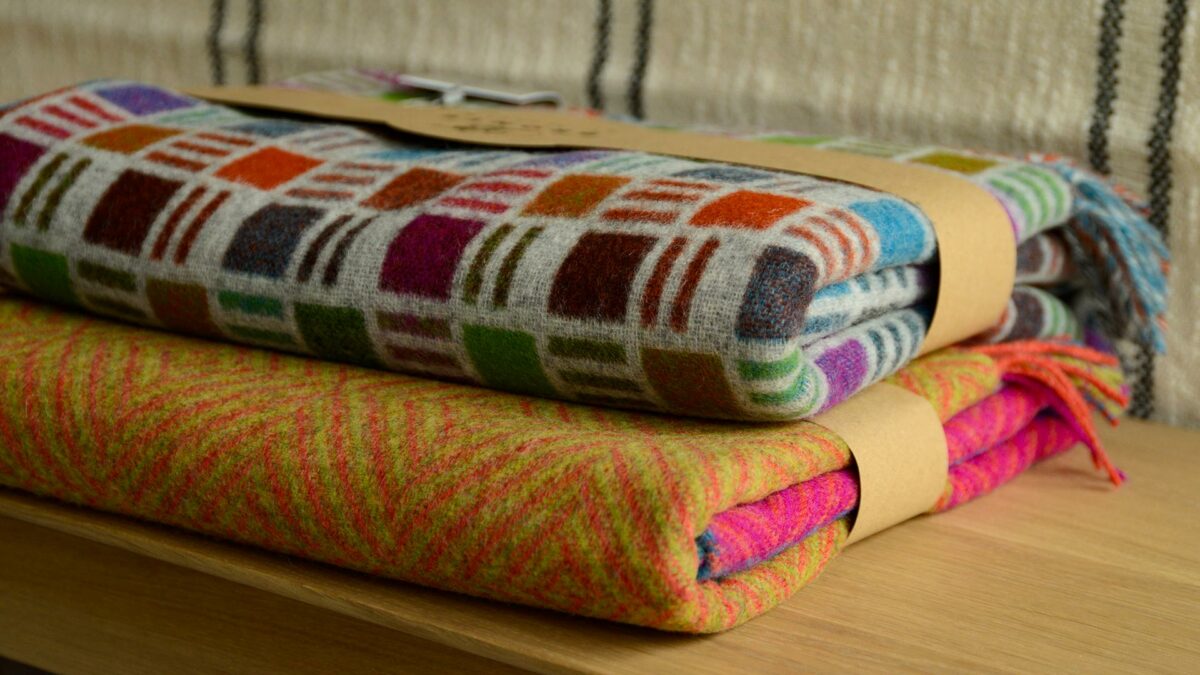 bold colours merino wool throws shown stacked