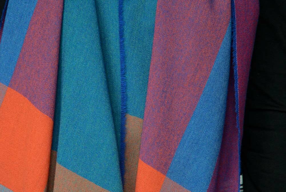 lightweight colourful woven merino wool scarf shown close up