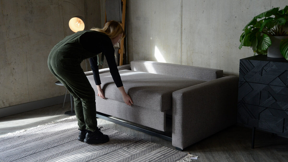 compact sofa bed in use