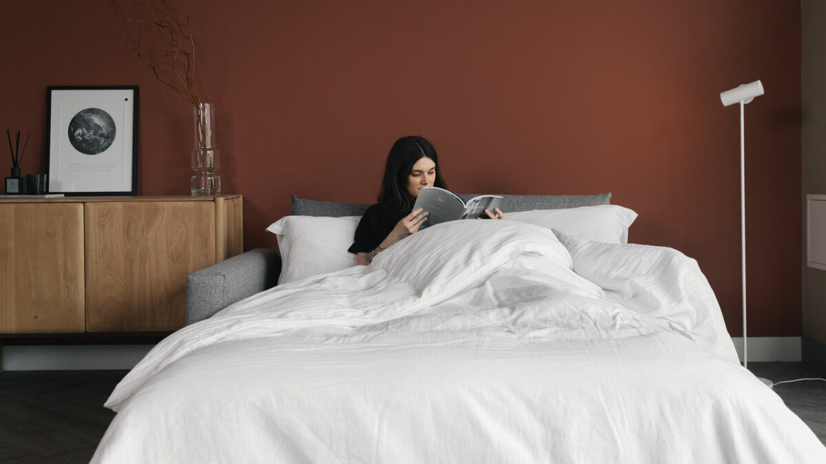 compact sofa bed with bedding