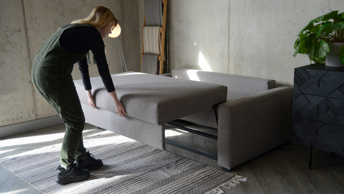 compact sofabed being pulled forward