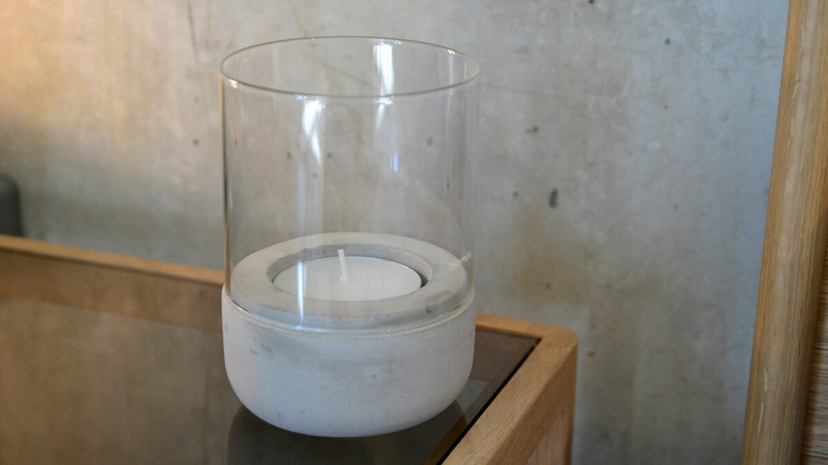 concrete and glass cnadle holder on bedside