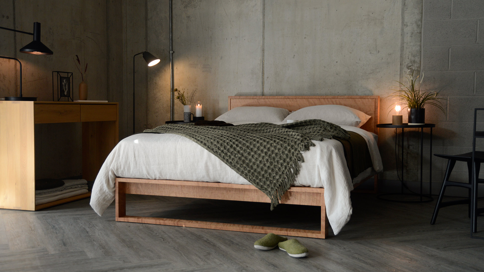 cosy industrial bedroom style with cherry wood Leith bed and hints of green