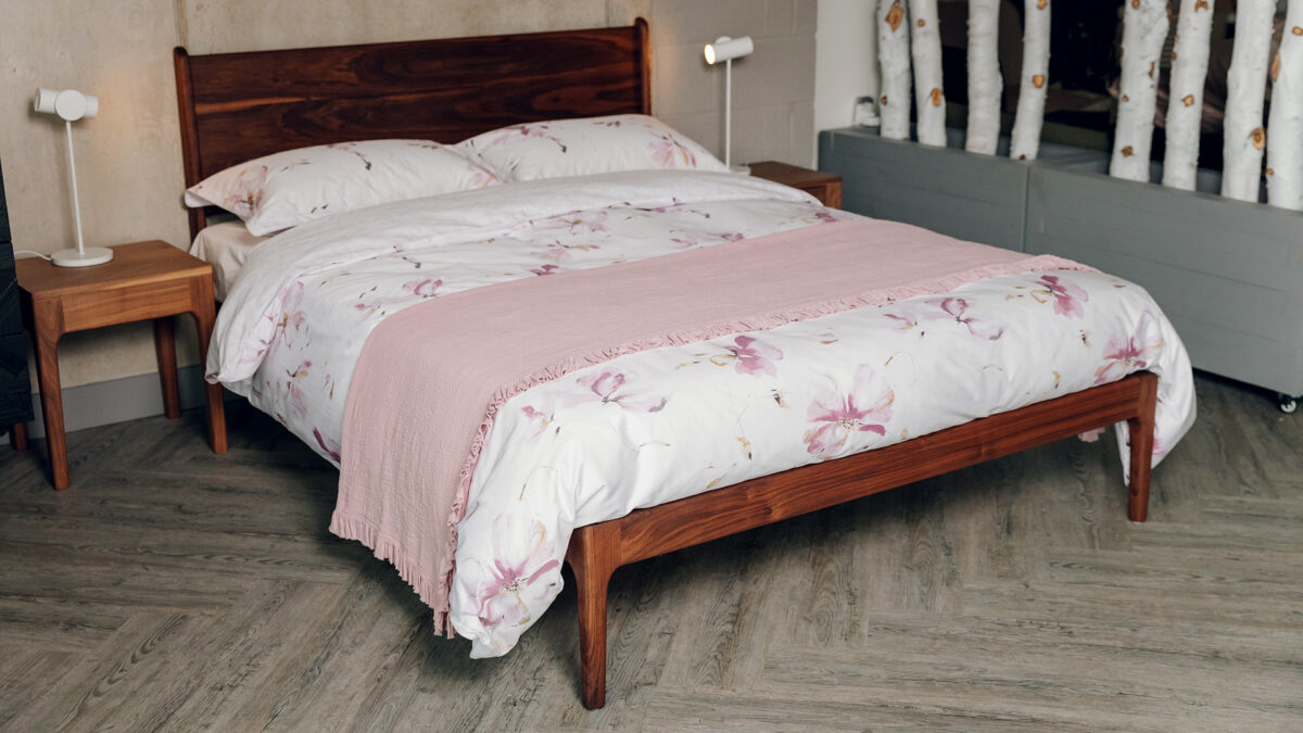 pale pink reversible duvet cover set with a floral print shown on a kingsize Camden bed