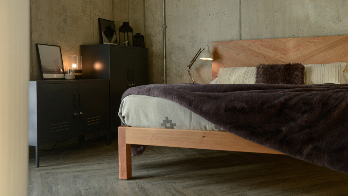 low level view of the Hathersage handmade solid wood bed with chevron headboard