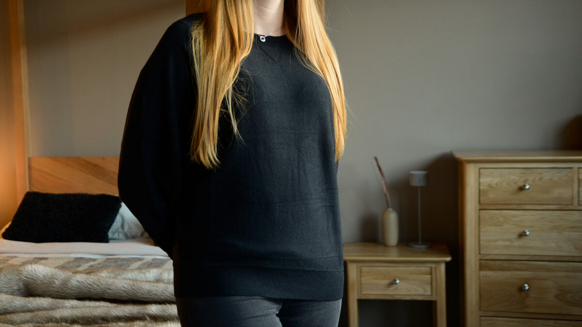 black jumper with batwing sleeves