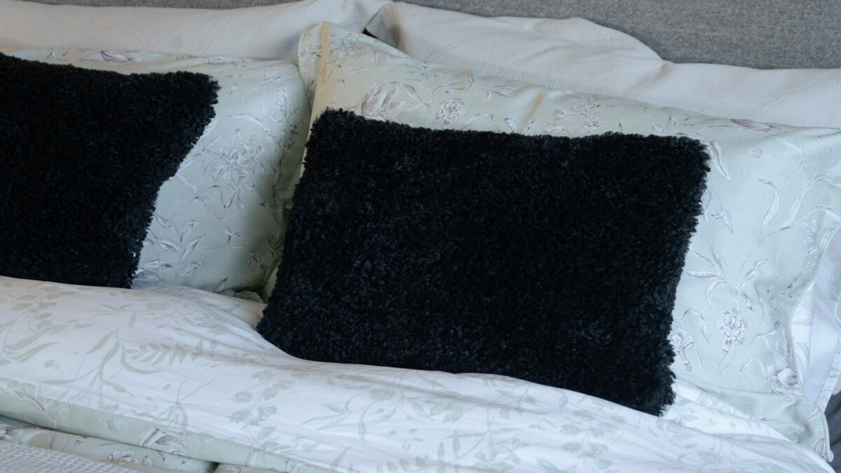 cosy faux sheepskin cushion cover black