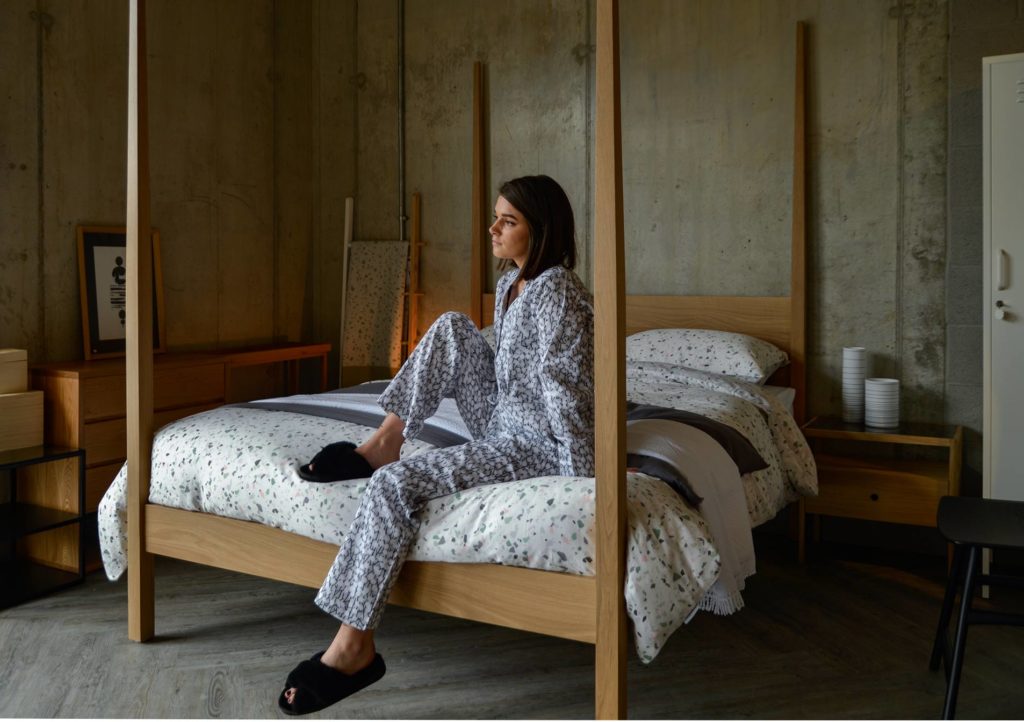 cosy-pyjamas-black-sheepskin-slippers-and-terrazzo-print-bedding