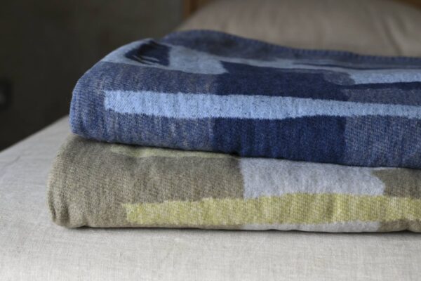 neatly stacked folded throws.