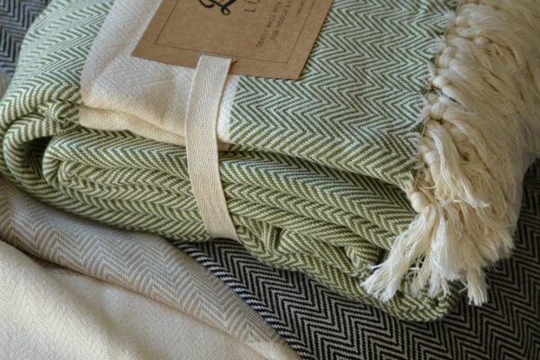 Ethically made woven cotton blankets with herringbone weave and in 3 colour options