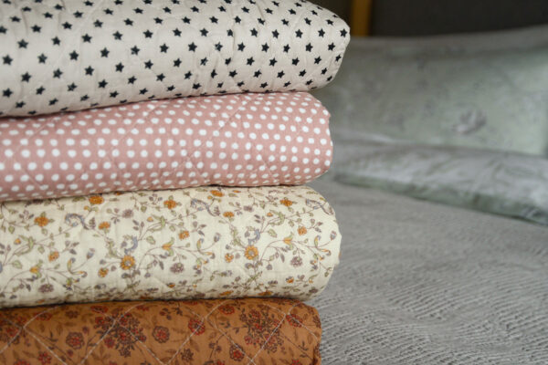 quilted cotton throws in various boho prints