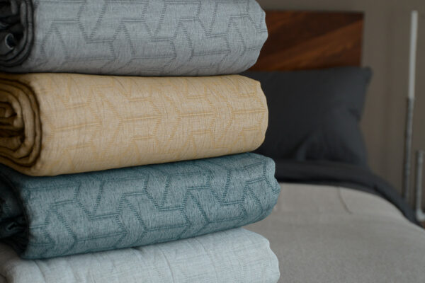 textured pattern bedspreads in a choice of 4 colours and made from recycled cotton