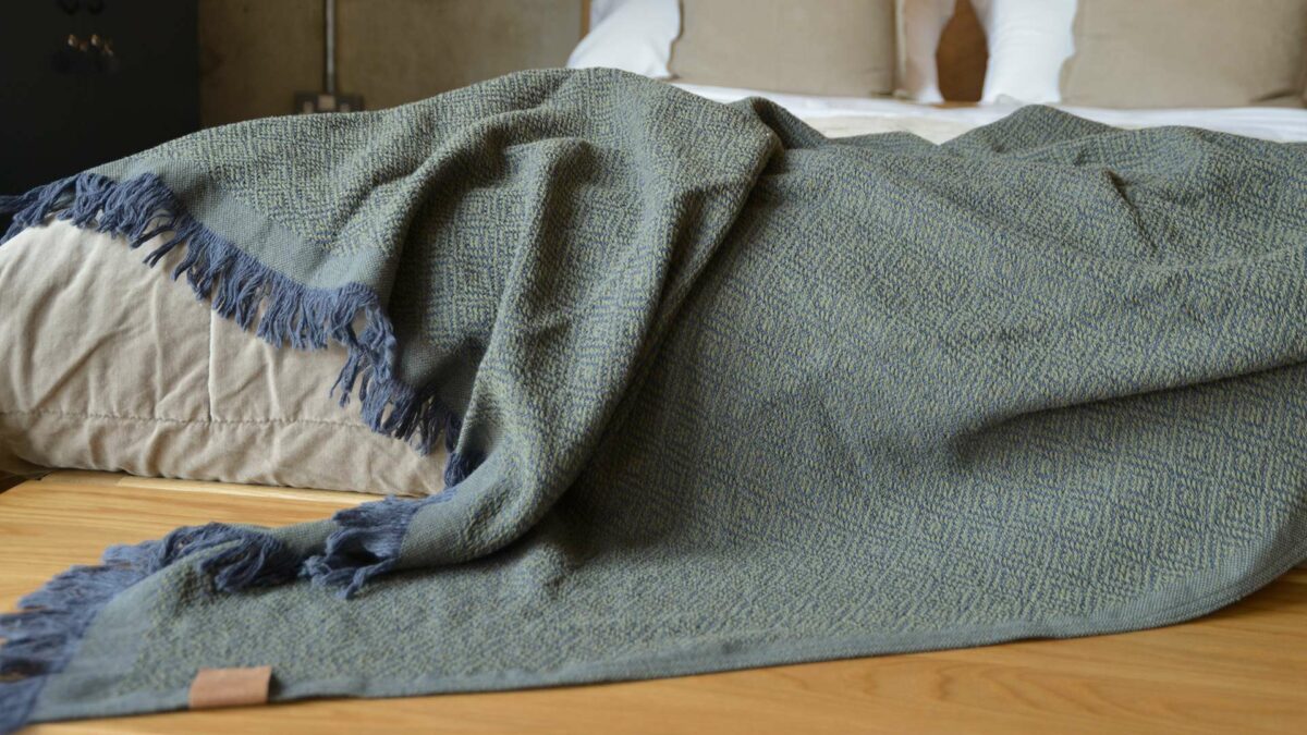 cotton rich woven design throw in olive green and blue