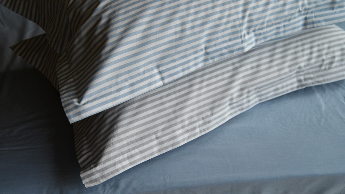 Grey and white, and Blue and white striped cotton pillowcases