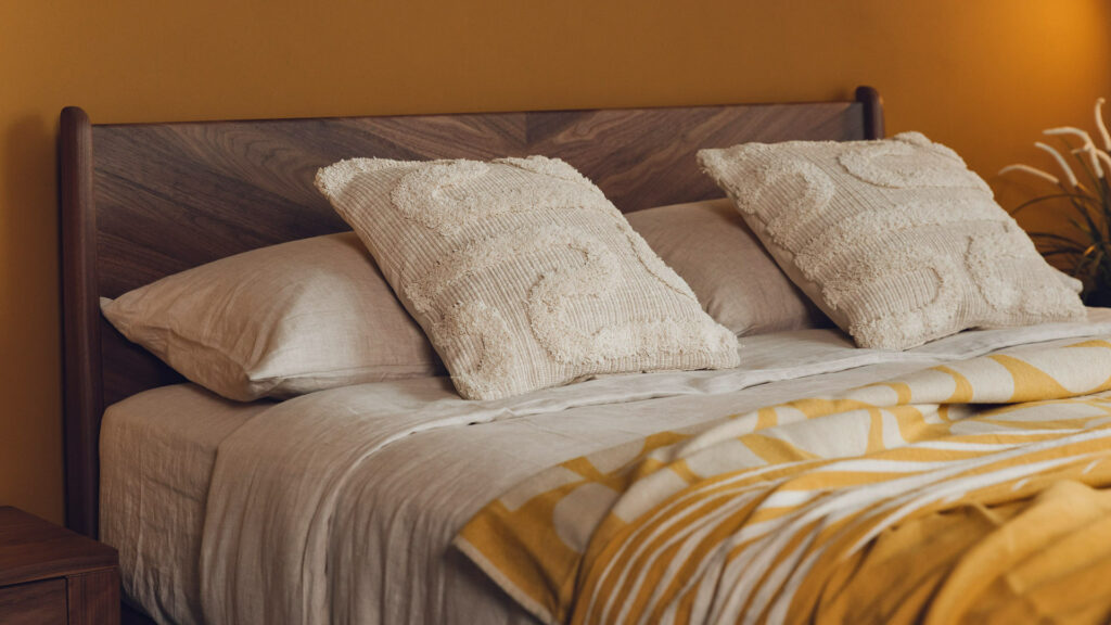 textured Moroccan style cotton cushions shown on a kingsize bed