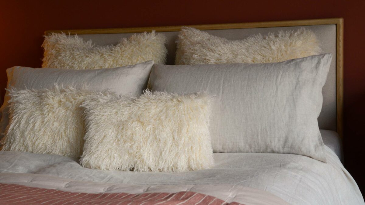 cream faux afghan oblong cushions