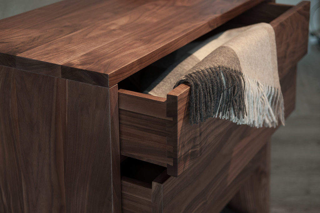 A close up view of the drawers in our Walnut storage chest by Black Lotus.