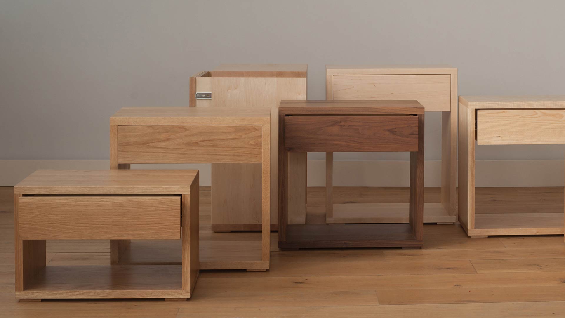 Hand crafted in Sheffield our Cube tables collection come in a range of wood choices to match your bed.