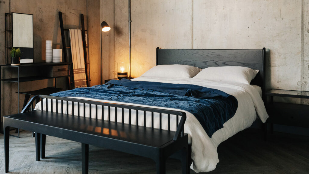 Industrial style bedroom with black oak furniture and Embroidered blue Velvet Bedspread