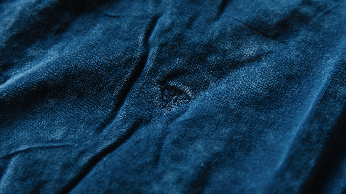 dark blue velvet look throw with bee stitch detail