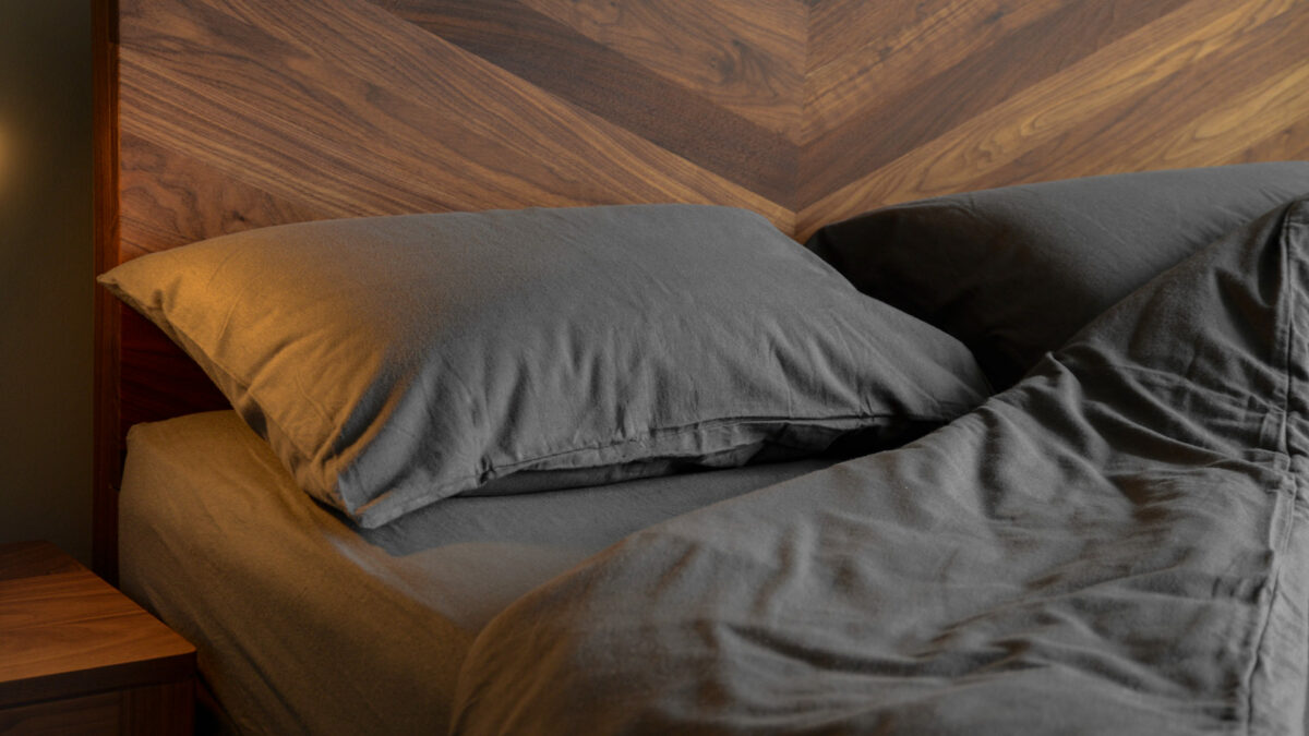 soft brushed cotton bedding in slate grey shown on a walnut Hathersage bed