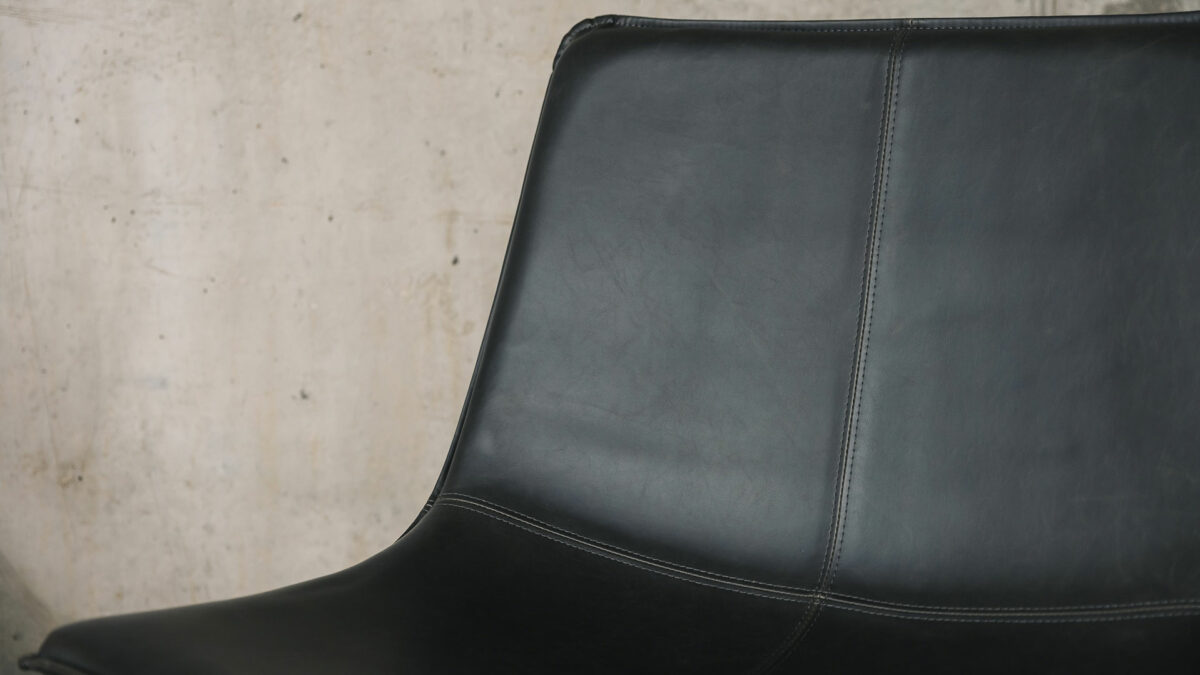 dark grey faux leather chair detail
