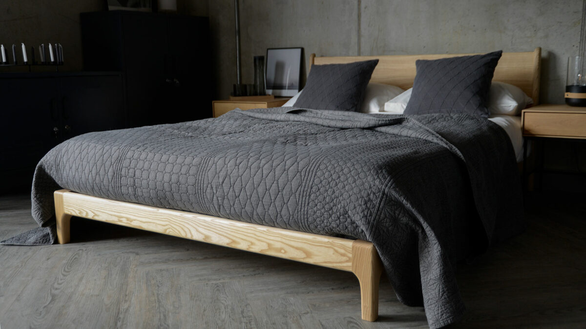 dark grey quilted patterned bedspread