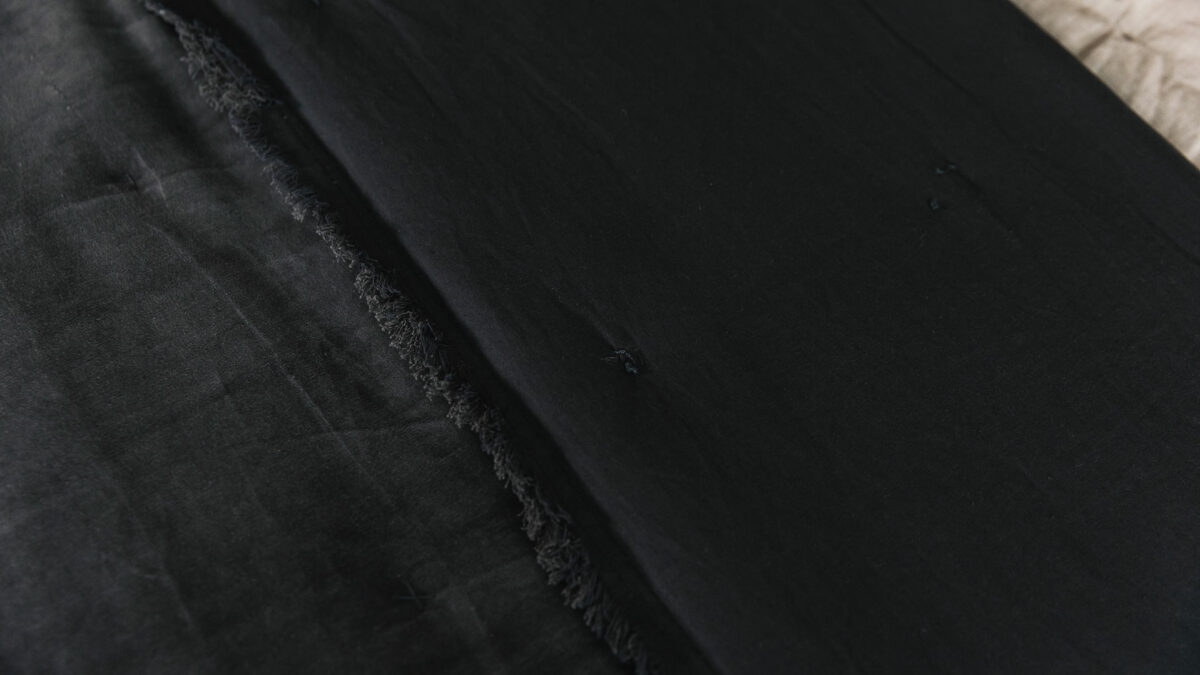 dark grey velevt quilt with fringe edge