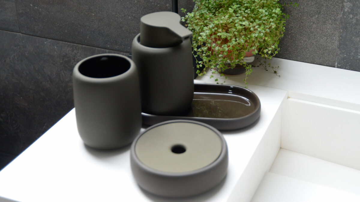 soft touch bathroom accessories in dark olive colour including soap dispenser and storage jar