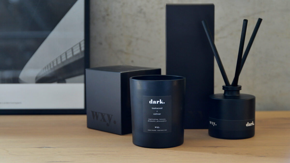 dark scented candle and room diffuser