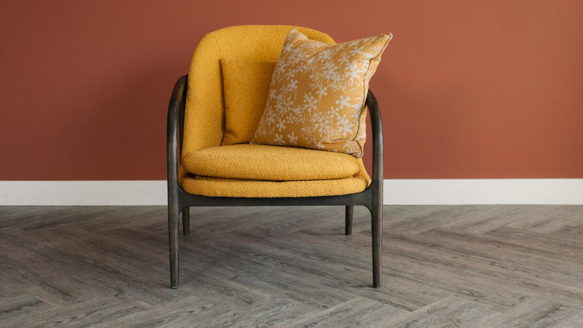 dark wood and mustard boucle bedroom chair