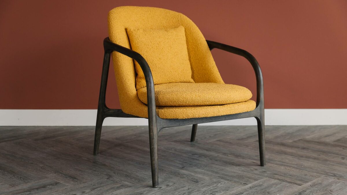 dark wood bedroom chair with mustard upholstery