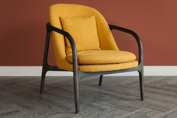 dark wood bedroom chair with mustard upholstery