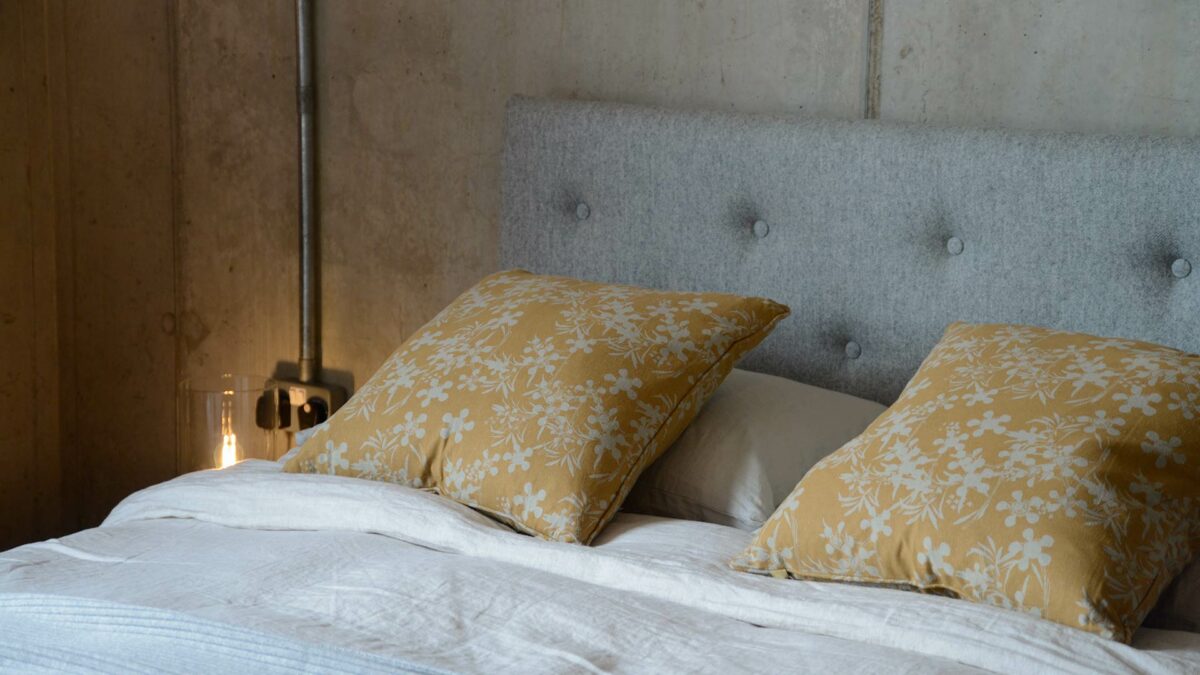 floral print cushions in a deep mustard yellow on taupe