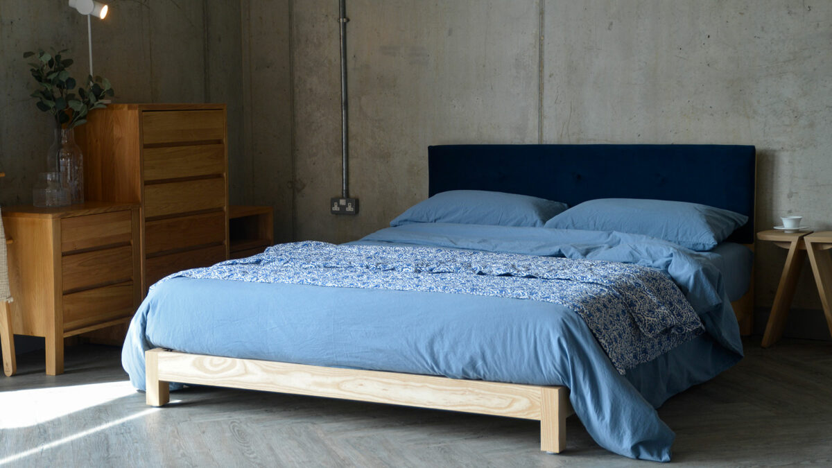 deep blue stonewash bedding on low Iona bed