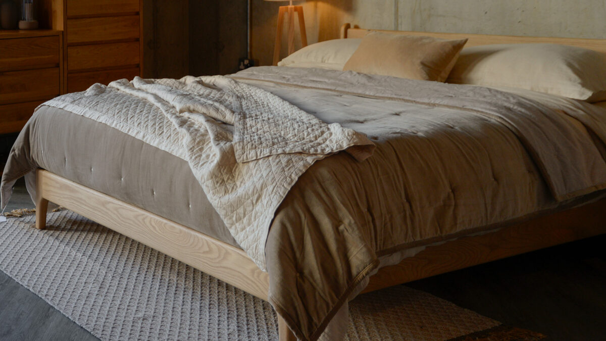 deep cream textured throw with velvet bedspread in hazelnut