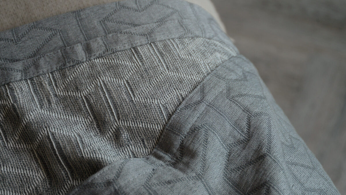 grey textured recycled cotton bedspread a close up showing the reverse side