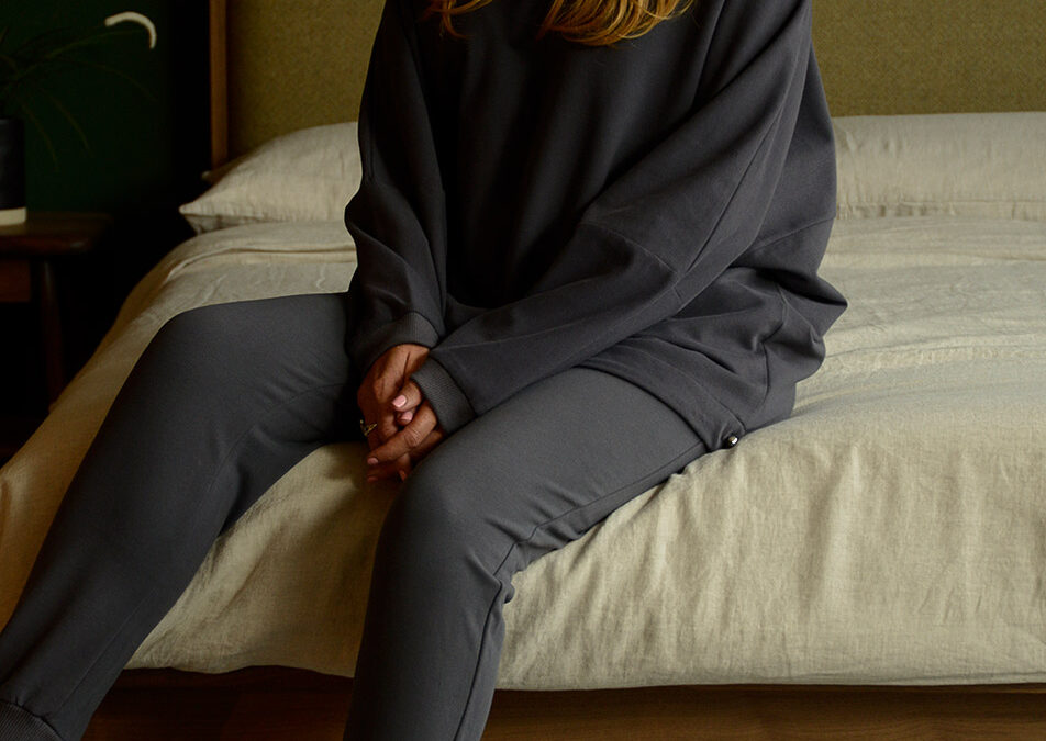 dark grey loose fit loungewear, top and bottoms shown on model