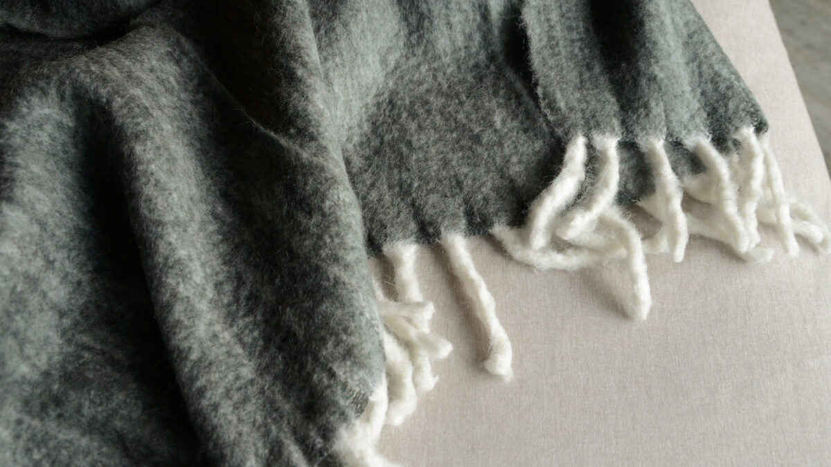 wool blend cosy deep grey colour throw with white fringes