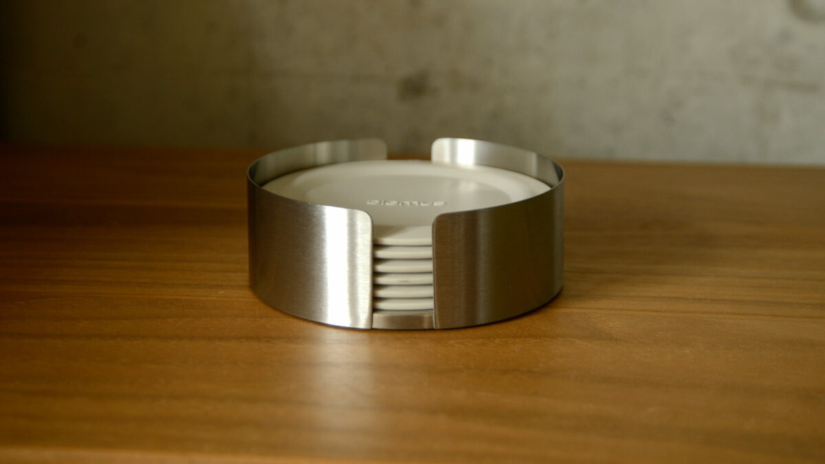 deep ivory silicone coasters set with stainless steel holder