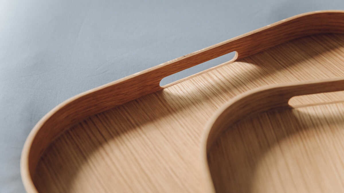 edged oak trays in two sizes and showing the carrying hand holes